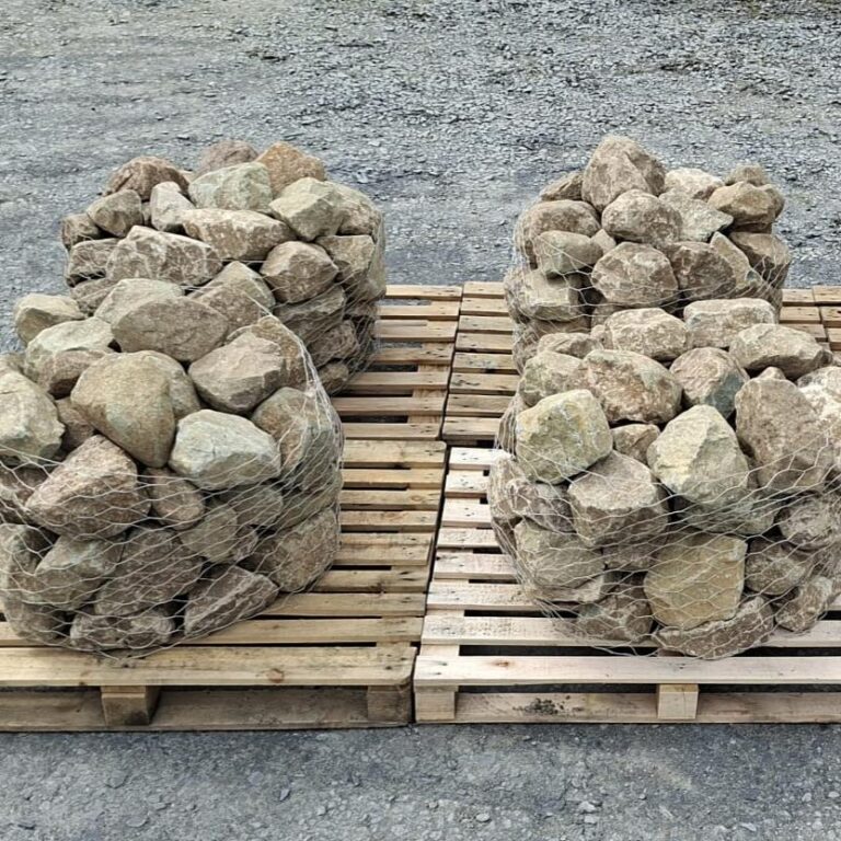 Four wire cages of glacial rockery stones arranged on pallets