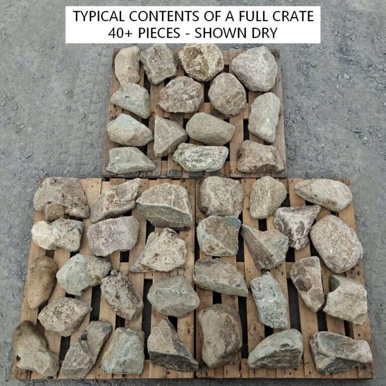 Dry mixed glacial stones laid out across pallets to show typical crate contents