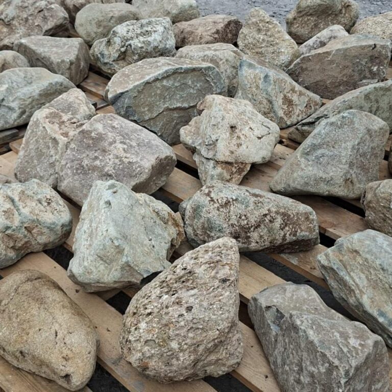 Close-up of dry mixed glacial stones with cream and grey mottling