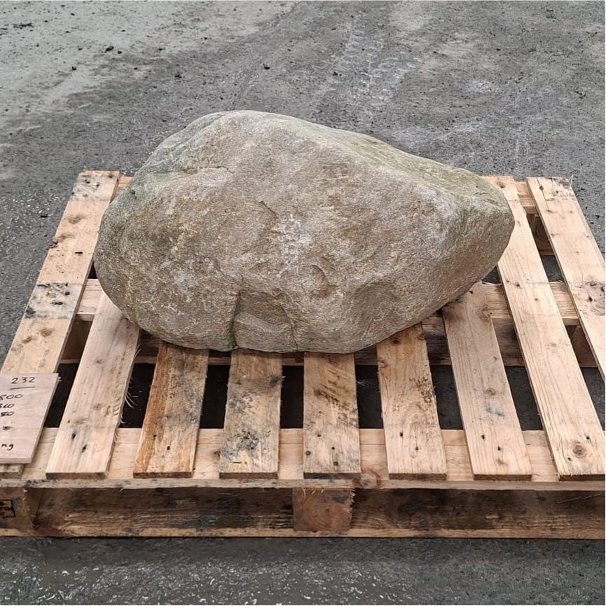 A natural stone boulder, glacial stone from North Wales, shown on a pallet.