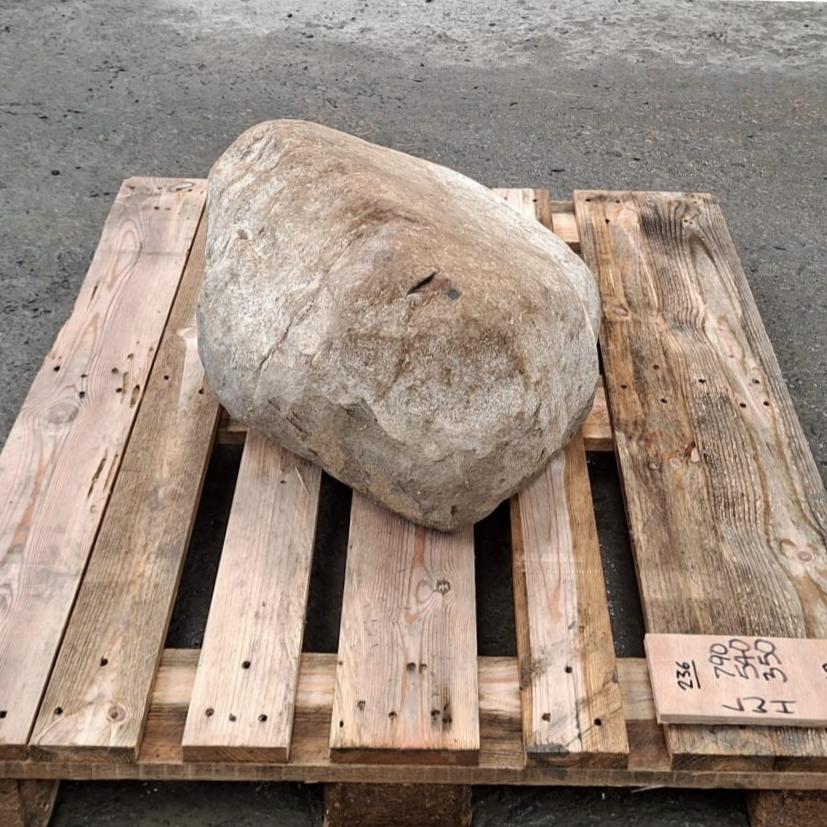 Unique glacial boulder displayed on a pallet.