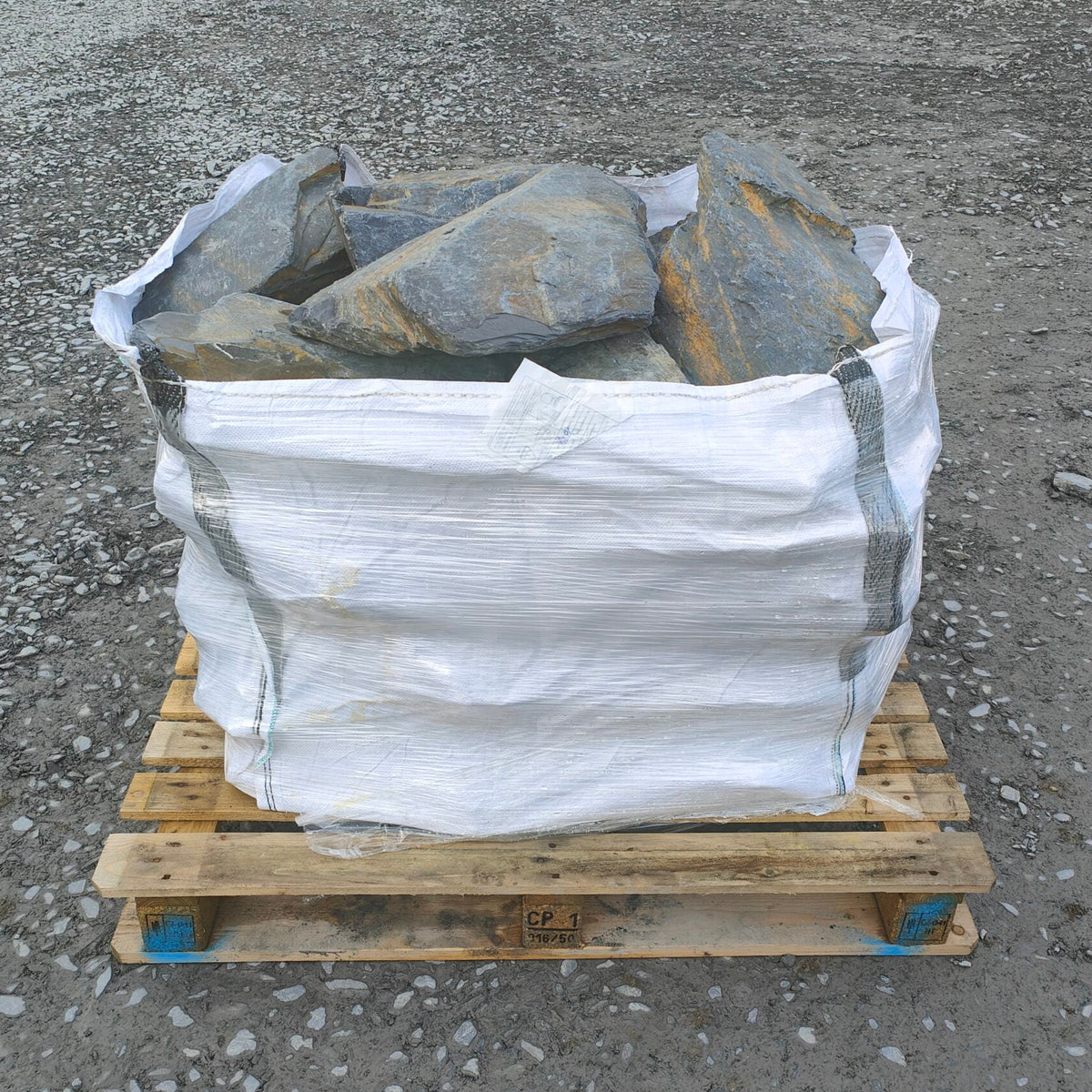 Large Welsh slate rockery stones in a bulk bag on a pallet