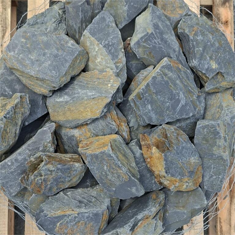 Close-up of mini Welsh slate stones with grey faces and ochre markings