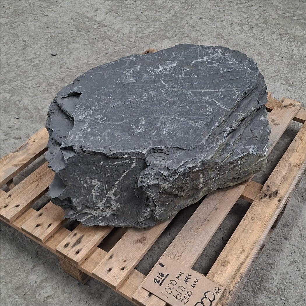 Flat top slate garden boulder.