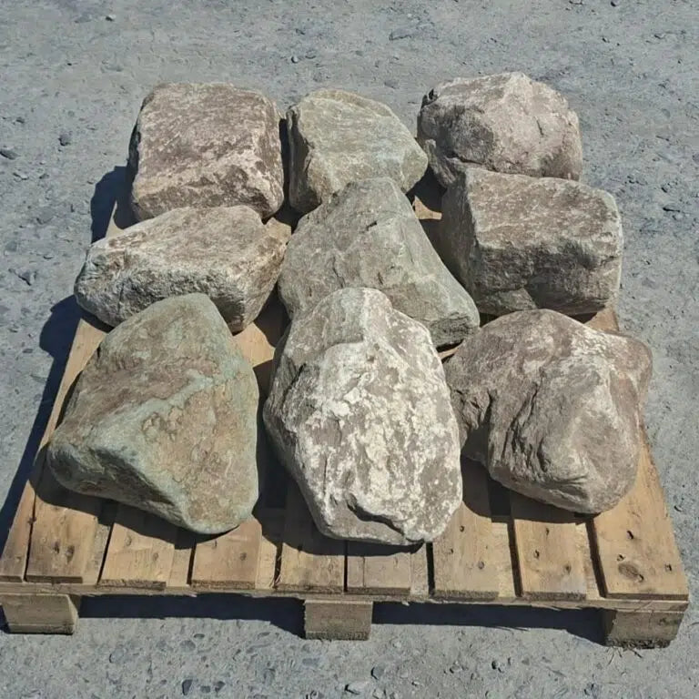 Pallet of glacial boulders with rounded edges and pale mottled faces