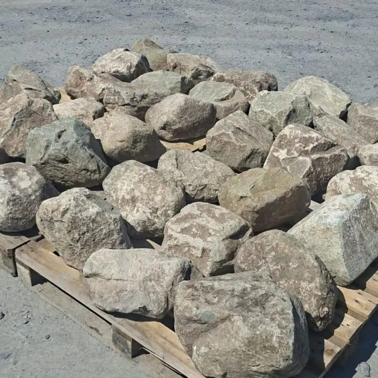 Dry glacial rockery boulders spread across adjacent wooden pallets
