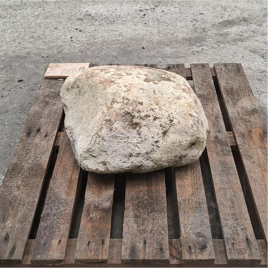 Unique glacial stone boulder with a light mottled colouring, displayed on a pallet.