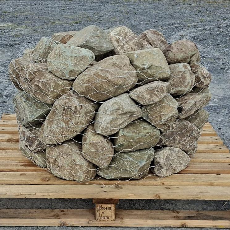 Glacial rockery stones enclosed in wire mesh on a wooden pallet
