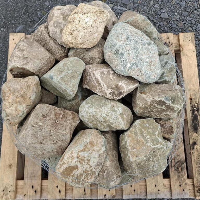 Glacial stones seen from above, showing mottled grey surfaces and brown veins