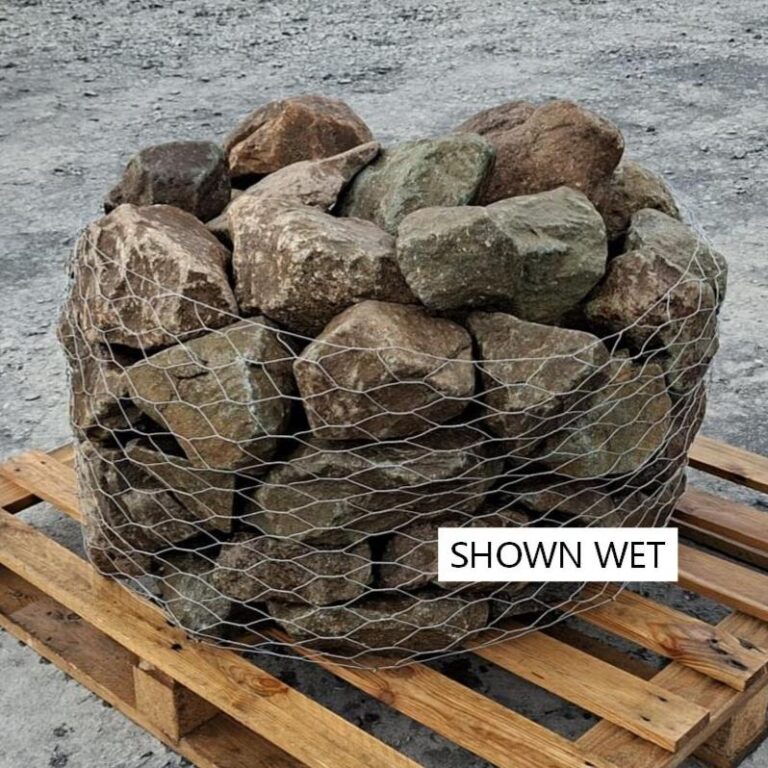 Wet glacial rockery stones stacked behind wire mesh