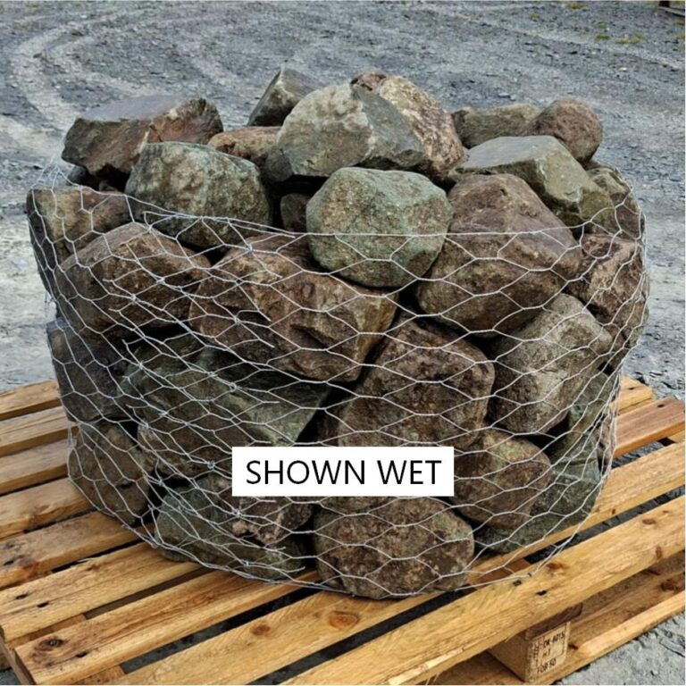 Wet glacial stones in a pallet cage, showing the irregular upper surfaces