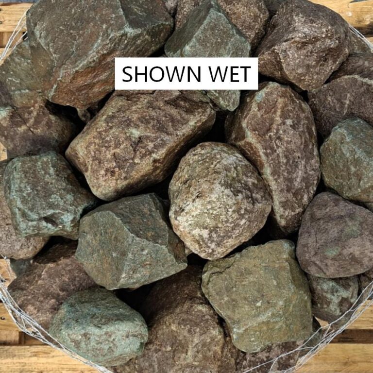 Wet glacial stones showing brown and green surfaces with pale veins