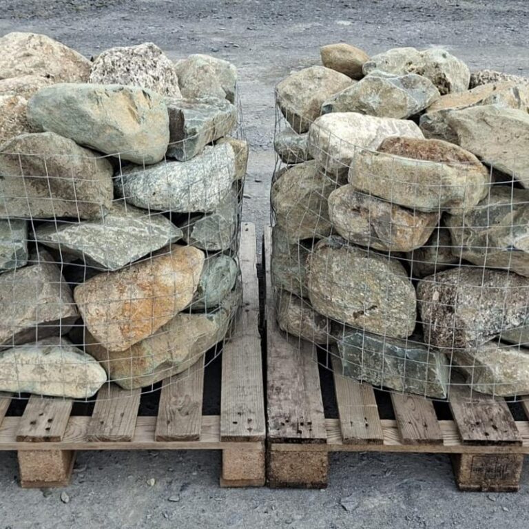 Two pallets of mixed glacial stones with cream, grey and brown surfaces