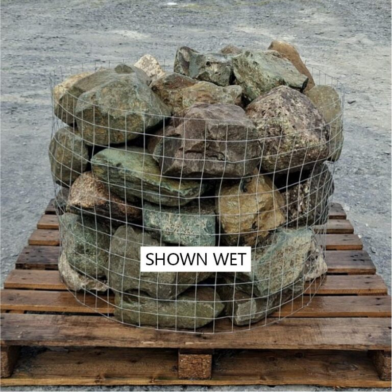 Wet mixed glacial rockery stones in a wire cage on a pallet