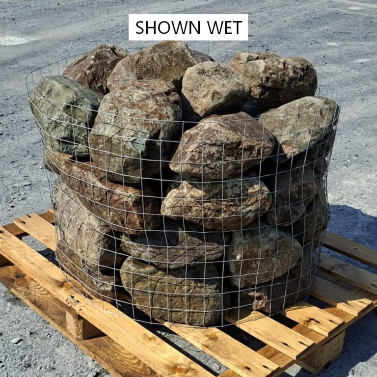 Wet glacial rockery stones in a pallet cage, showing darker brown surfaces