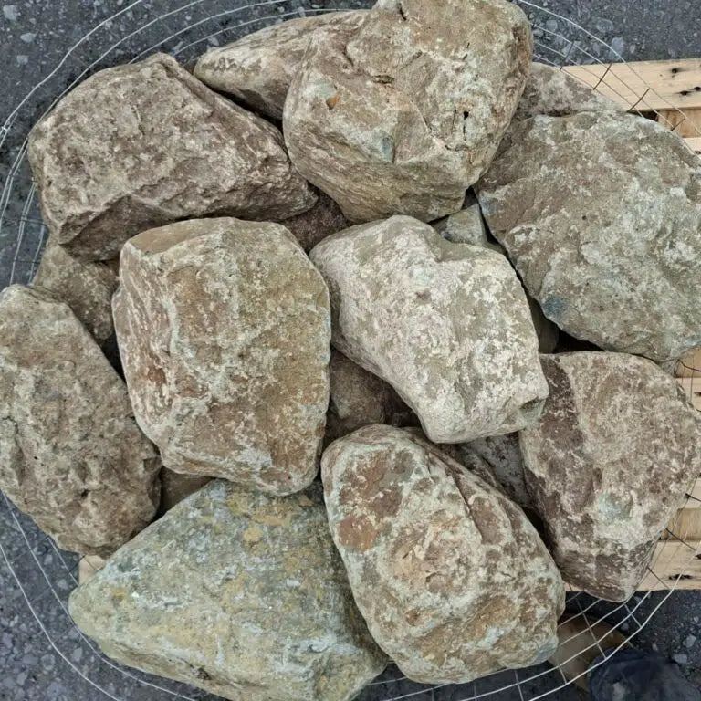 Dry glacial stones showing grey, cream and brown markings from above