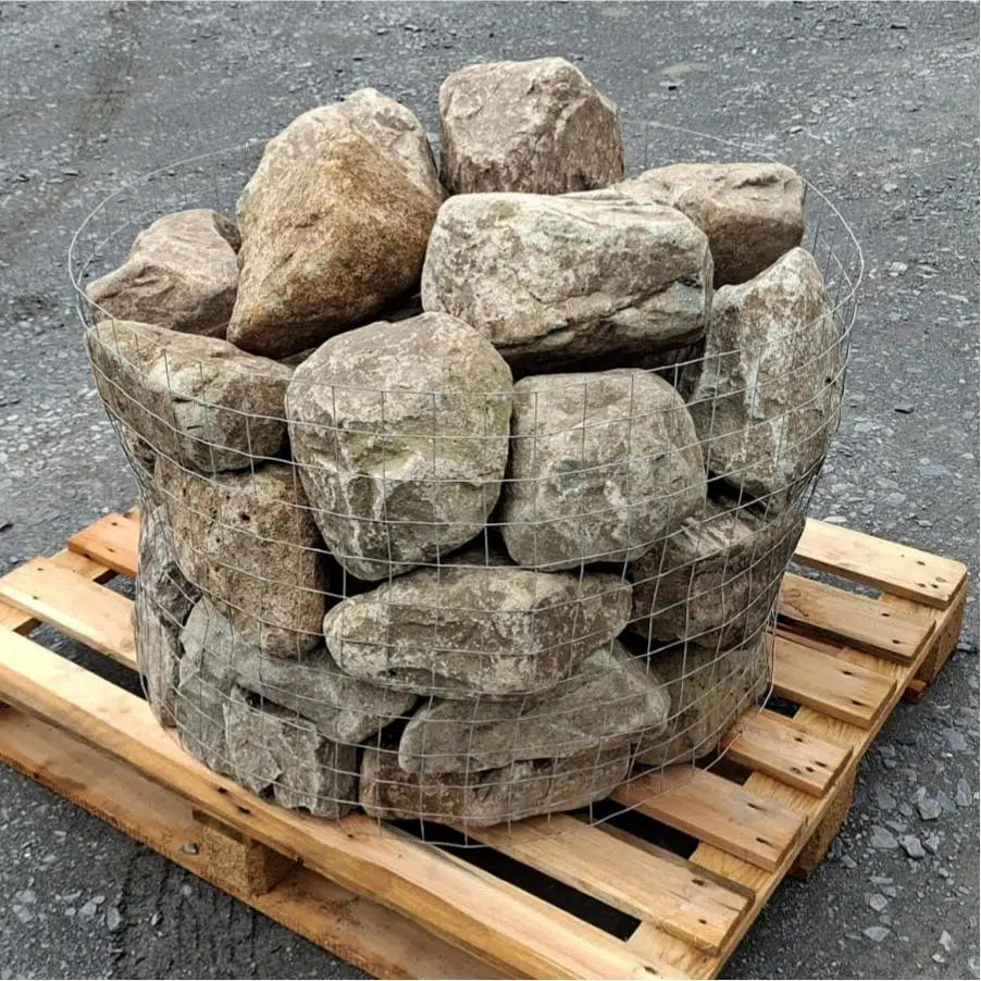Pallet of glacial rockery stones showing rounded edges and mottled surfaces