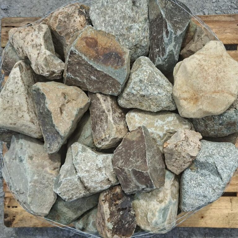 Mixed glacial stones seen from above, showing grey, cream and brown colours