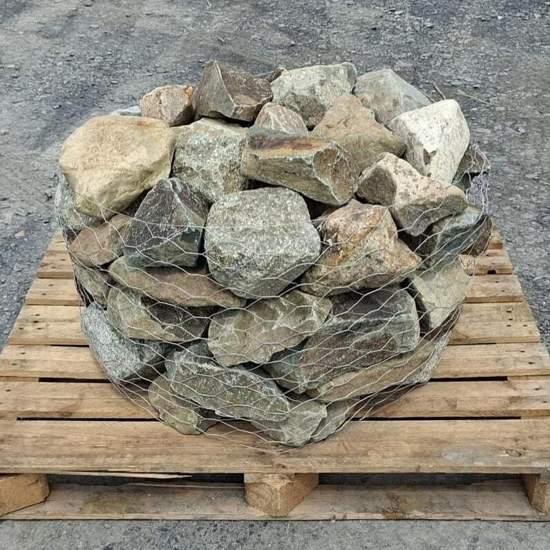 Full pallet of mixed glacial stones enclosed in wire mesh