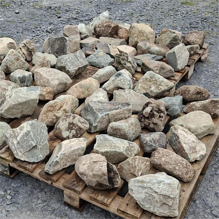Dry mixed glacial stones arranged individually across wooden pallets