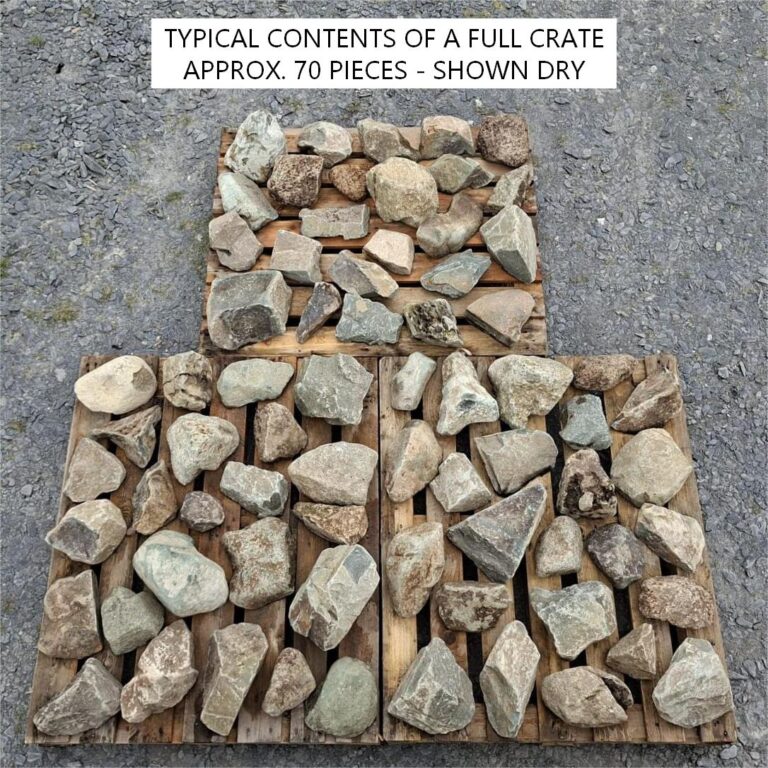Dry mixed glacial stones laid out across pallets to show typical crate contents