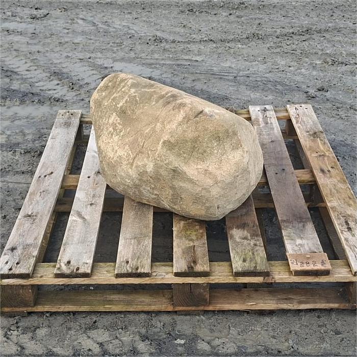 Glacial boulder showing a rounded end beneath a sharply sloping ridge
