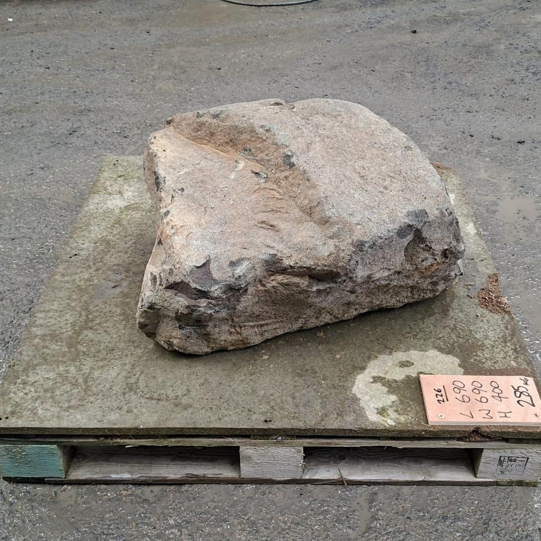 Garden stone boulder displayed on a pallet.