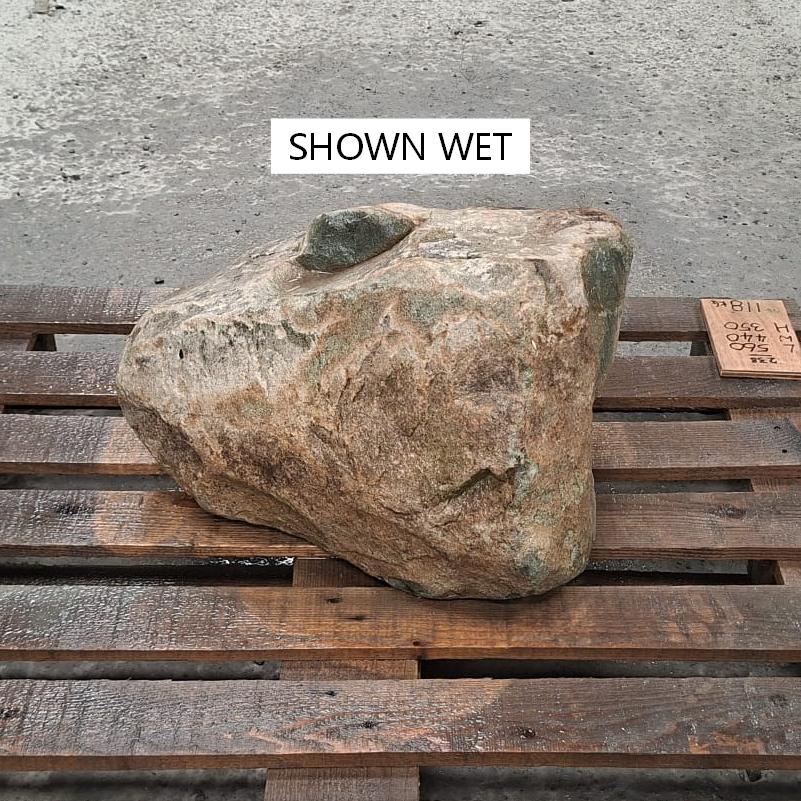 Unique glacial boulder shown wet on a pallet.