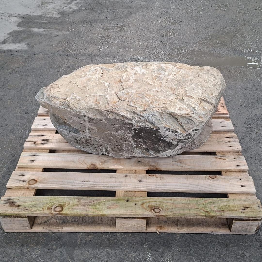 Unique stone boulder with natural colour tones, including brown / black markings.