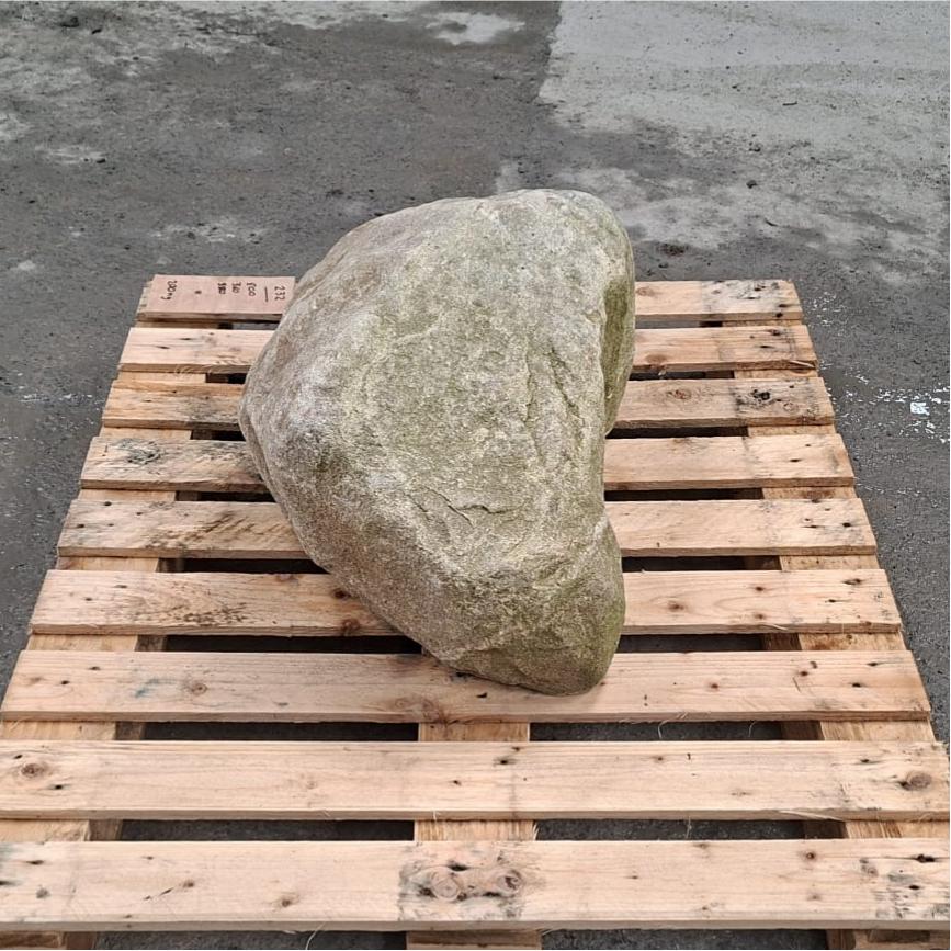 Glacial stone boulder with natural shape and colour tones.