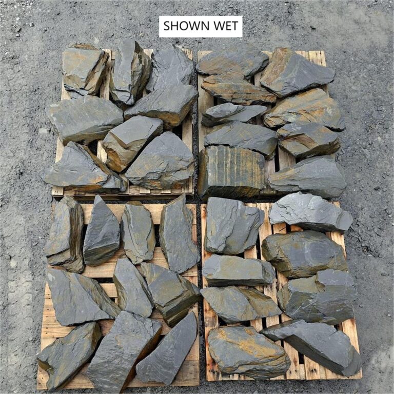 Large wet slate stones spread across pallets, showing grey and rusty colours