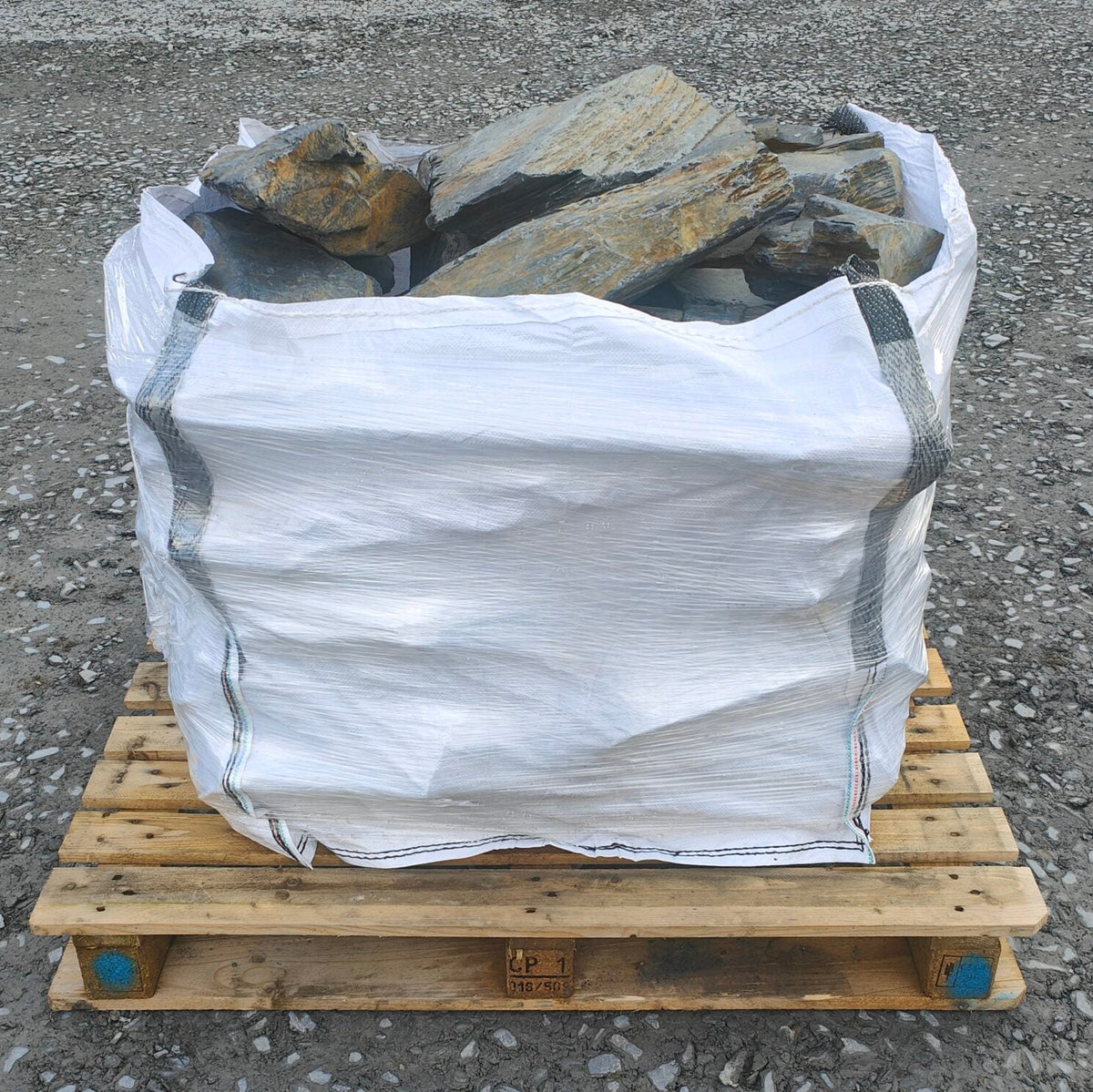 Bulk bag of large slate rockery stones with grey and rusty layered surfaces
