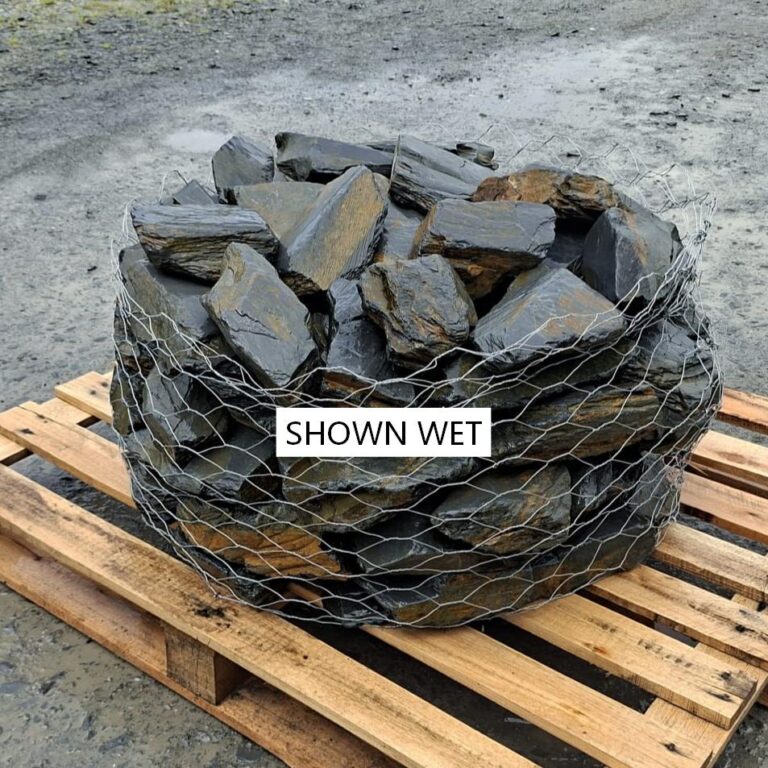 Wet mini slate rockery stones showing darker grey and ochre colours