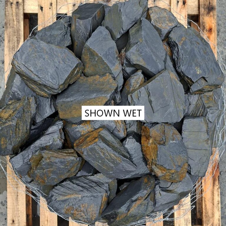 Wet mini slate stones photographed from above, showing layered edges