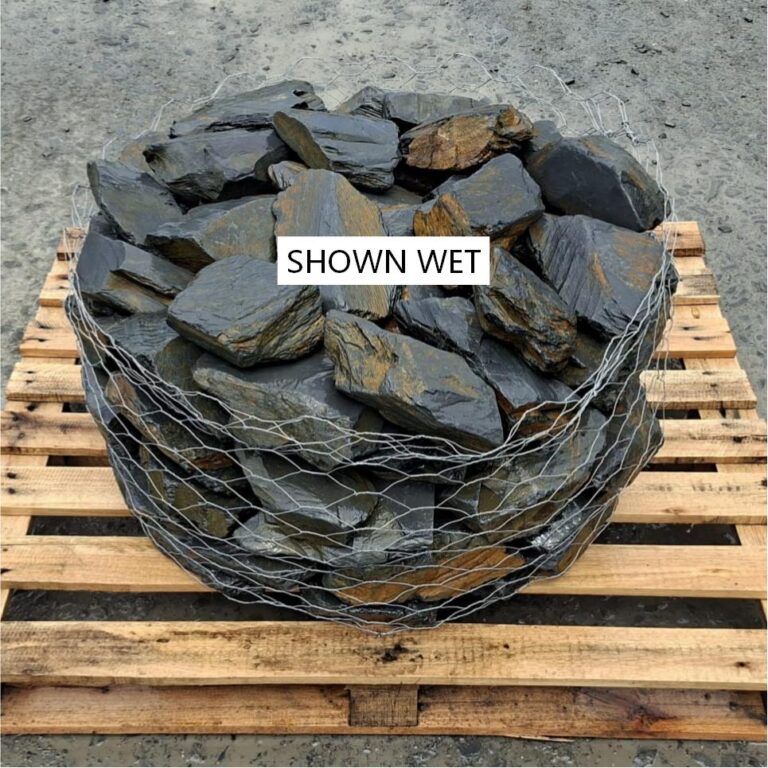 Wet mini slate stones packed in a wire cage, seen from above