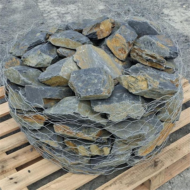 Grey and rusty brown mini slate stones packed inside wire mesh