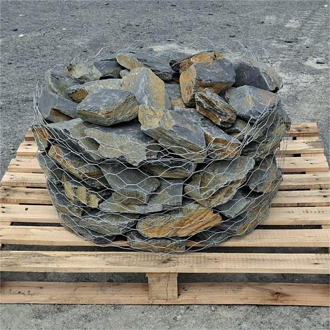 Stacked mini slate stones showing varied shapes and natural rusty edges